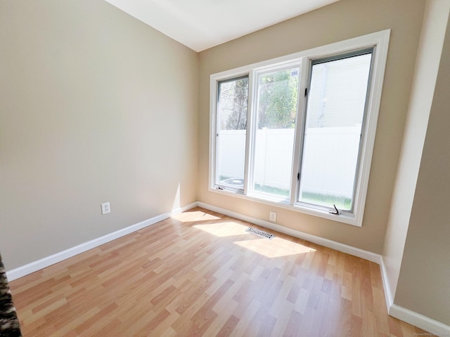279 New Haven Ave Apt H, Milford, CT 06460 - unfurnished room with baseboards and light wood-style flooring