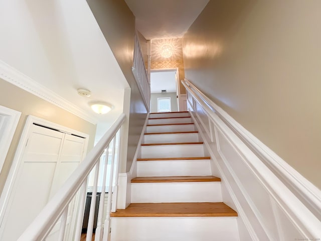 279 New Haven Ave Apt H, Milford, CT 06460 - stairway featuring a decorative wall and crown molding