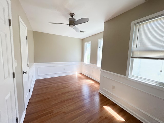 279 New Haven Ave Apt H, Milford, CT 06460 - spare room featuring wainscoting, wood finished floors, and a ceiling fan