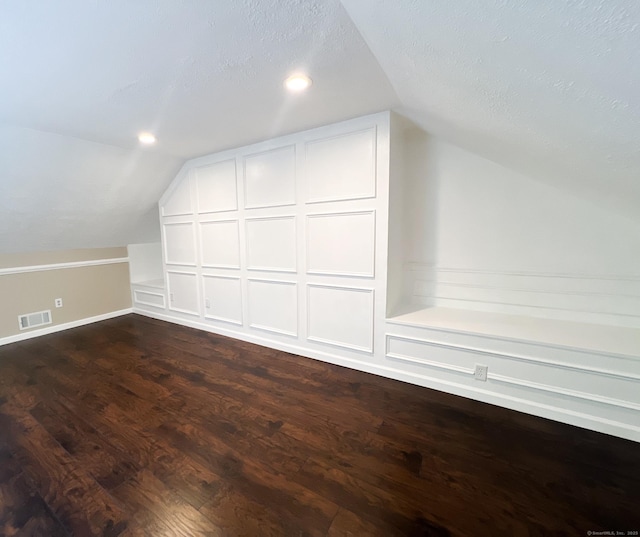 279 New Haven Ave Apt H, Milford, CT 06460 - bonus room featuring vaulted ceiling, a decorative wall, dark wood-type flooring, and recessed lighting
