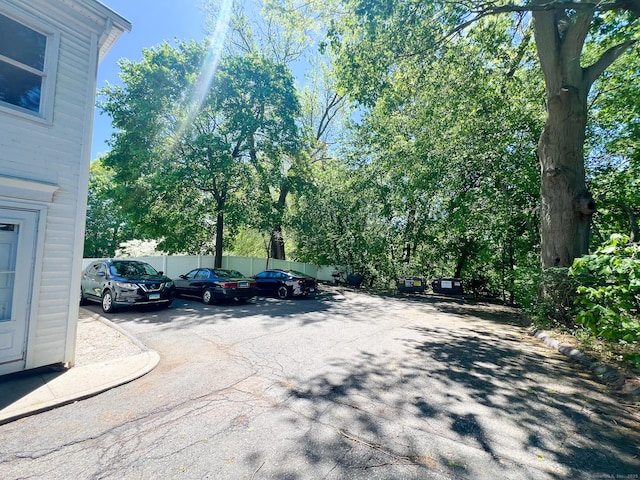 279 New Haven Ave Apt H, Milford, CT 06460 - uncovered parking lot with fence