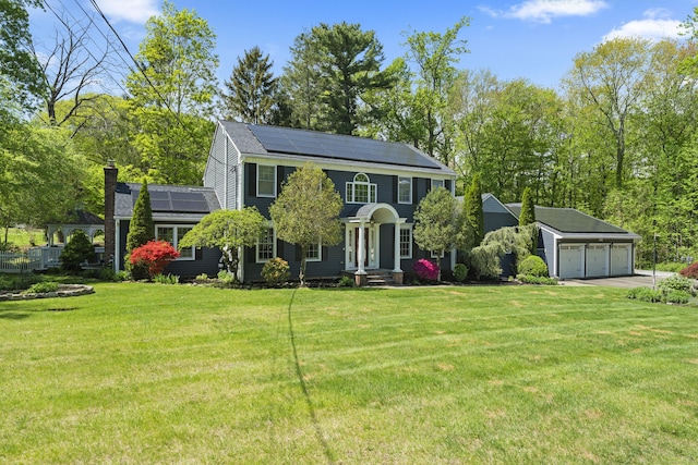 9 Benham Hill Pl, Hamden, CT 06514 - colonial house with a detached garage, solar panels, a chimney, an outbuilding, and a front lawn