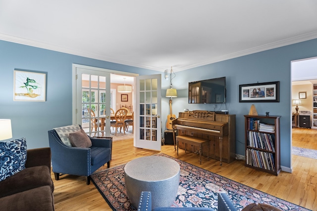 9 Benham Hill Pl, Hamden, CT 06514 - living room featuring ornamental molding, wood finished floors, and french doors
