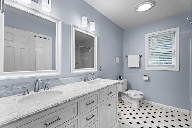 9 Benham Hill Pl, Hamden, CT 06514 - full bath featuring baseboards, toilet, double vanity, a shower, and tile patterned floors