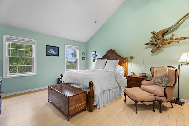9 Benham Hill Pl, Hamden, CT 06514 - bedroom with multiple windows, light wood finished floors, high vaulted ceiling, and baseboards
