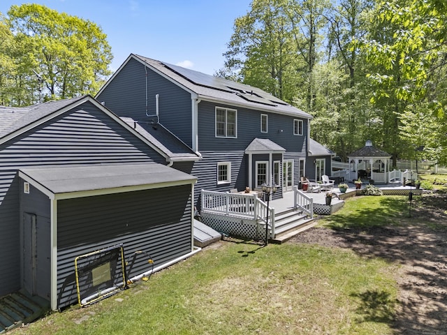9 Benham Hill Pl, Hamden, CT 06514 - rear view of property with a gazebo, a yard, a deck, solar panels, and roof with shingles