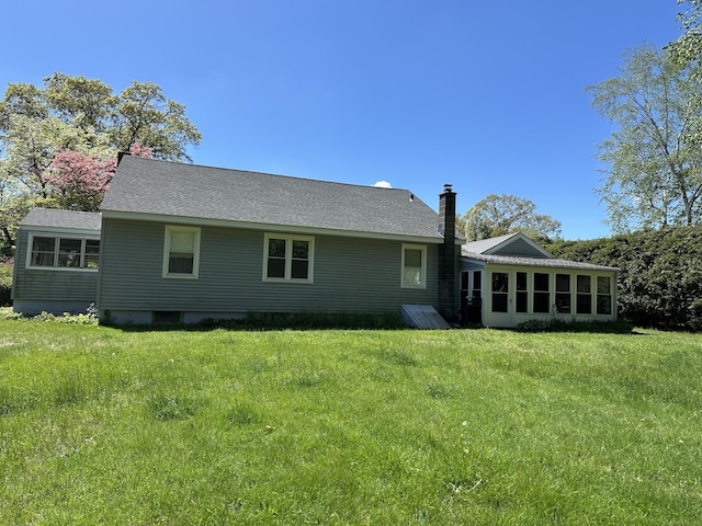 119 Chambers St, Manchester, CT 06042 - rear view of house featuring a chimney, a yard, and a sunroom
