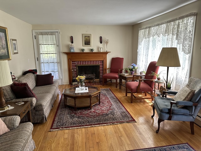119 Chambers St, Manchester, CT 06042 - living room with wood finished floors and a brick fireplace