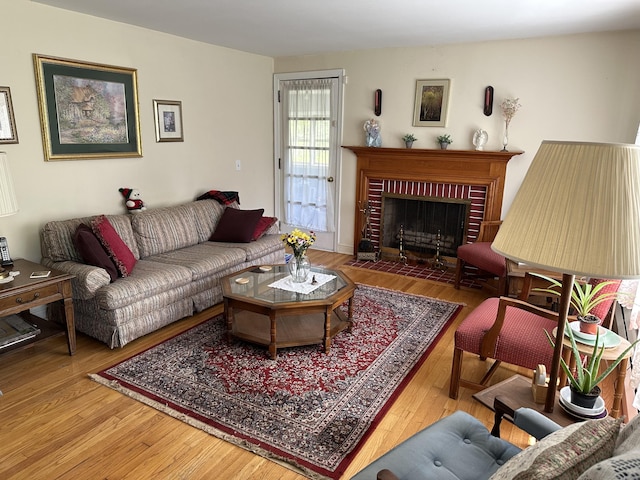 119 Chambers St, Manchester, CT 06042 - living area with wood finished floors and a brick fireplace