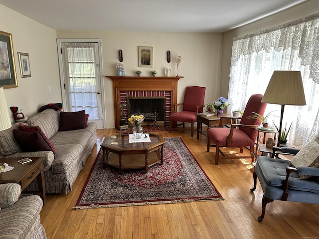 119 Chambers St, Manchester, CT 06042 - living area with wood finished floors and a brick fireplace