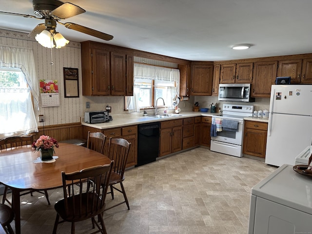 119 Chambers St, Manchester, CT 06042 - kitchen with white appliances, a sink, wallpapered walls, light countertops, and ceiling fan