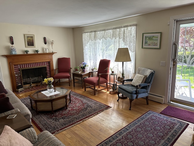 119 Chambers St, Manchester, CT 06042 - living area with a baseboard radiator, wood finished floors, and a fireplace