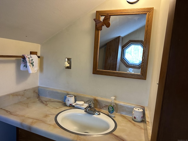 119 Chambers St, Manchester, CT 06042 - bathroom with lofted ceiling, vanity, and a textured ceiling
