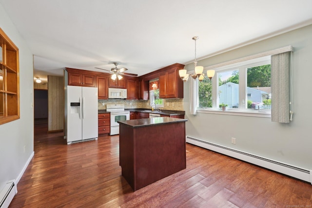 11 Jamestown Rd, Hamden, CT 06518 - kitchen with white appliances, baseboard heating, dark countertops, and dark wood-type flooring