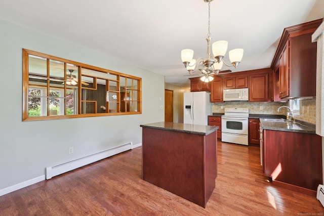 11 Jamestown Rd, Hamden, CT 06518 - kitchen featuring white appliances, a baseboard heating unit, a chandelier, a kitchen island, and dark wood-style floors