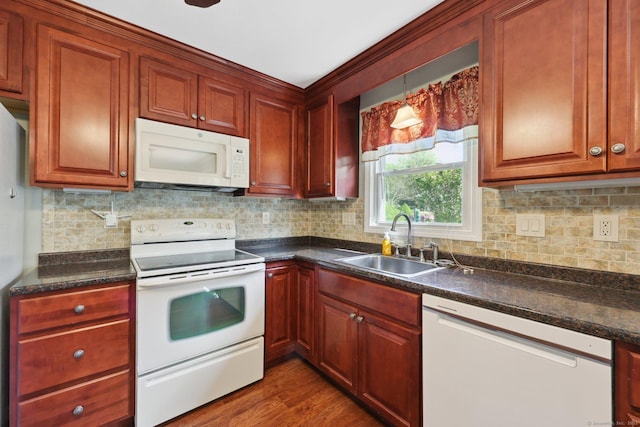 11 Jamestown Rd, Hamden, CT 06518 - kitchen with white appliances, a sink, dark countertops, backsplash, and dark wood-style floors