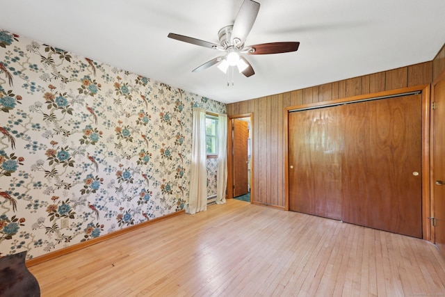 11 Jamestown Rd, Hamden, CT 06518 - unfurnished bedroom with hardwood / wood-style floors, baseboards, wallpapered walls, ceiling fan, and a closet