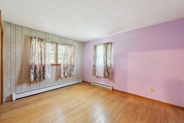 11 Jamestown Rd, Hamden, CT 06518 - spare room featuring a baseboard radiator, a baseboard heating unit, baseboards, and hardwood / wood-style flooring