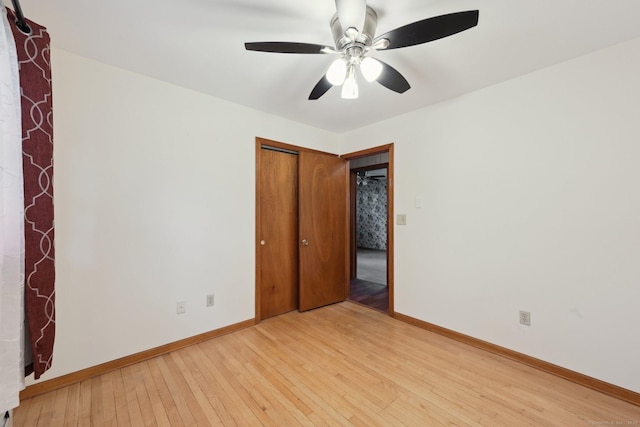 11 Jamestown Rd, Hamden, CT 06518 - unfurnished bedroom with light wood finished floors, baseboards, a closet, and a ceiling fan