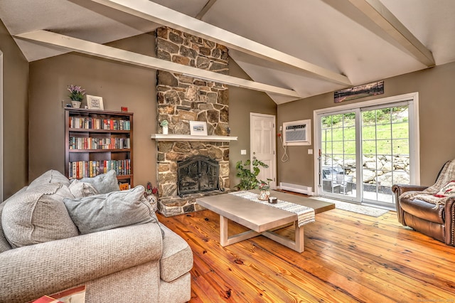 220 Northwood Dr, Guilford, CT 06437 - living room with an AC wall unit, a fireplace, hardwood / wood-style floors, and a baseboard radiator