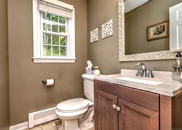 220 Northwood Dr, Guilford, CT 06437 - half bath with toilet, vanity, a baseboard radiator, tile patterned floors, and baseboards