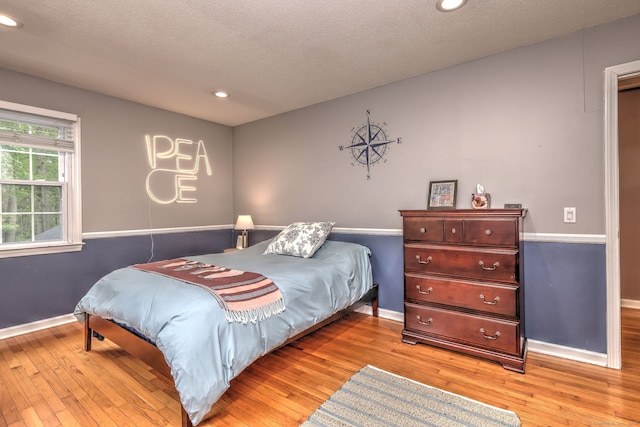 220 Northwood Dr, Guilford, CT 06437 - bedroom with light wood-type flooring, baseboards, recessed lighting, and a textured ceiling