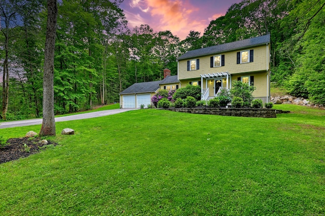 220 Northwood Dr, Guilford, CT 06437 - colonial-style house featuring a pergola, a lawn, and concrete driveway