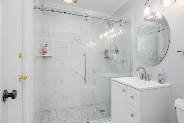 bathroom featuring a stall shower, vanity, toilet, and a ceiling fan