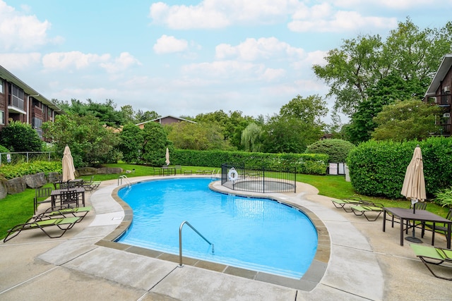 community pool with a patio area