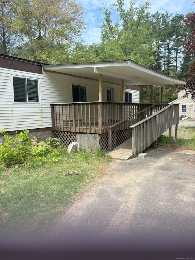 74 Cisar Rd, Willington, CT 06279 - manufactured / mobile home featuring a wooden deck
