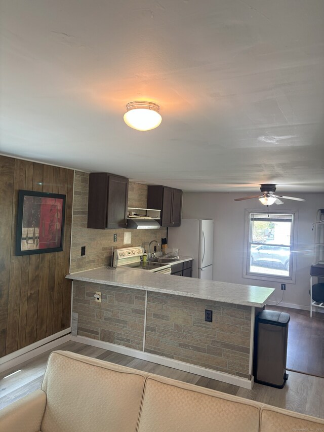74 Cisar Rd, Willington, CT 06279 - kitchen with light countertops, wood finished floors, electric range oven, freestanding refrigerator, and a peninsula