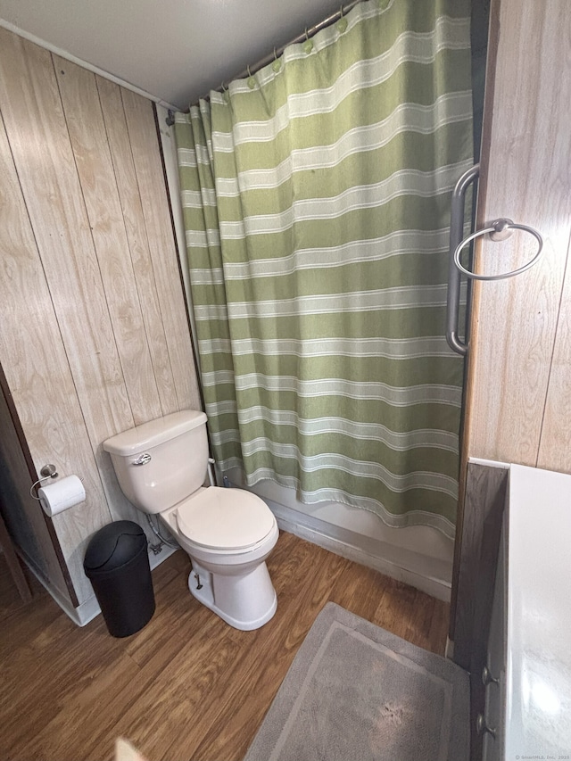 74 Cisar Rd, Willington, CT 06279 - full bath with wood finished floors, toilet, wood walls, and shower / bathtub combination with curtain