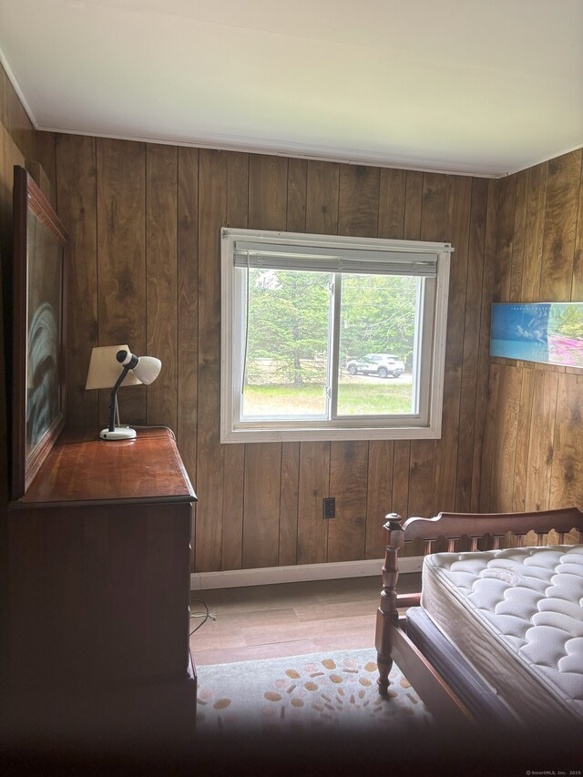 74 Cisar Rd, Willington, CT 06279 - bedroom featuring wood finished floors, wooden walls, and baseboards