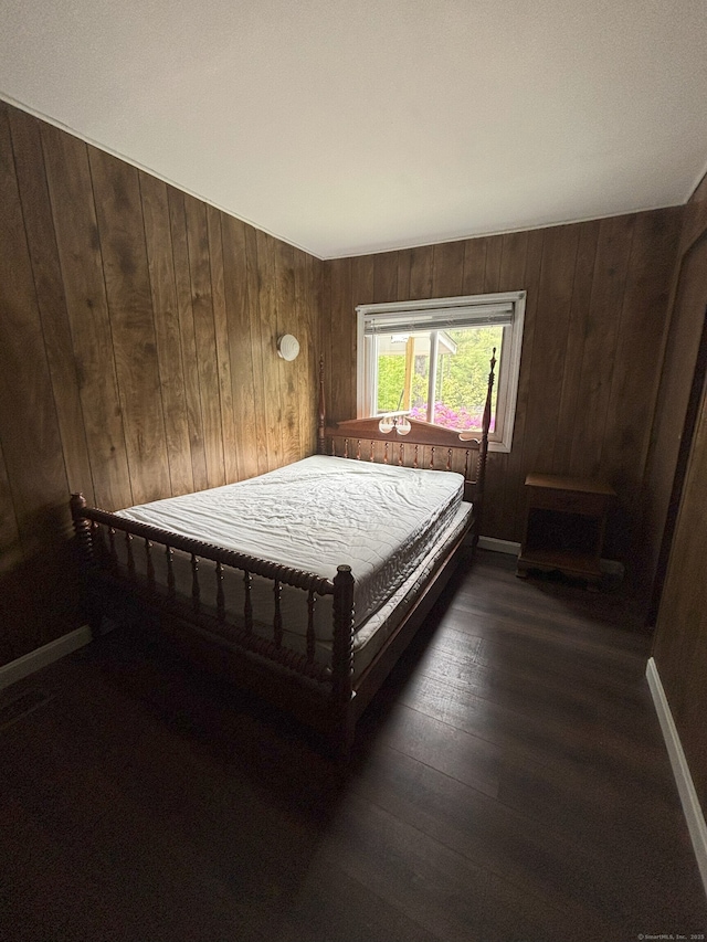 74 Cisar Rd, Willington, CT 06279 - bedroom featuring wood walls and dark wood finished floors