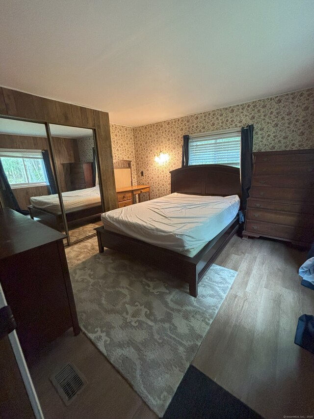 74 Cisar Rd, Willington, CT 06279 - bedroom featuring wallpapered walls and wood finished floors