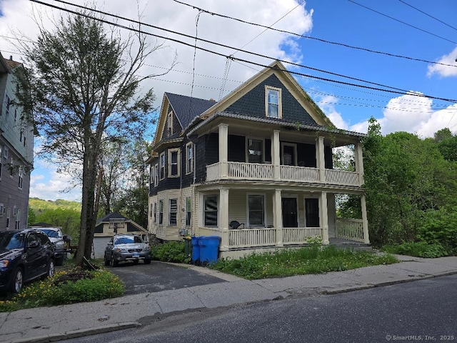 215 Lincoln St, Waterbury, CT 06710 - view of front of home with a porch and a balcony