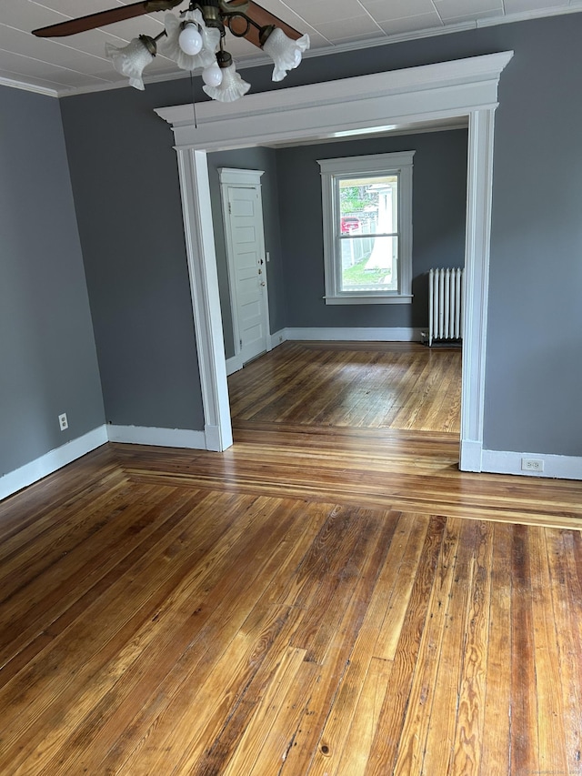 215 Lincoln St, Waterbury, CT 06710 - spare room with ceiling fan, radiator, ornamental molding, wood-type flooring, and baseboards