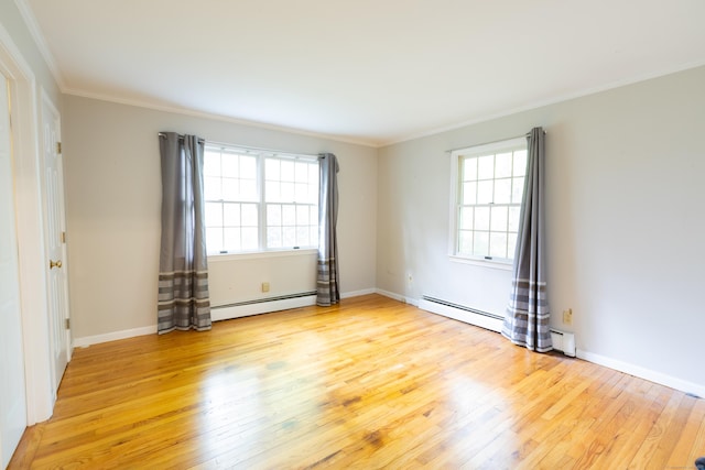 138 White Birch Dr, Guilford, CT 06437 - unfurnished room with a baseboard radiator, light wood-style flooring, crown molding, and baseboards