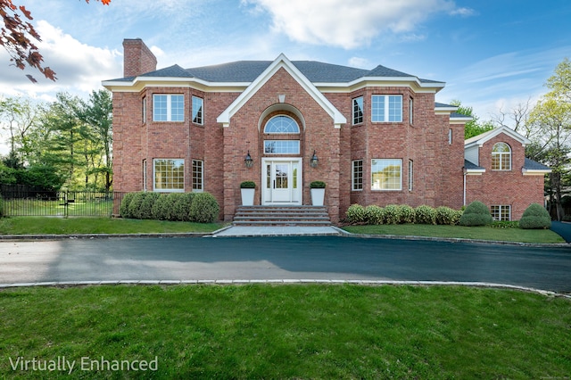 19 Stone Fence Ln, Stamford, CT 06903 - view of front of home with a chimney and brick siding