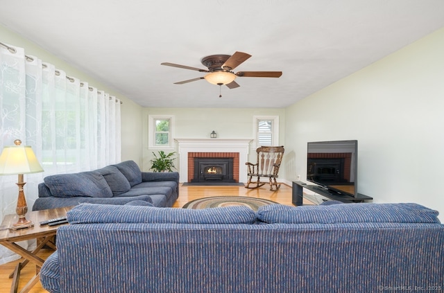 995 Maple St, Wethersfield, CT 06109 - living area with a fireplace, wood finished floors, and a ceiling fan