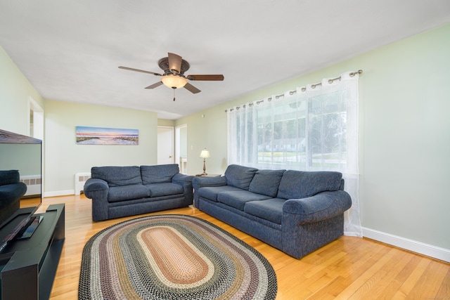 995 Maple St, Wethersfield, CT 06109 - living room with light wood-style floors, ceiling fan, and baseboards