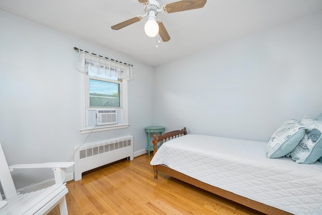 995 Maple St, Wethersfield, CT 06109 - bedroom featuring radiator heating unit, light wood-type flooring, baseboards, ceiling fan, and cooling unit