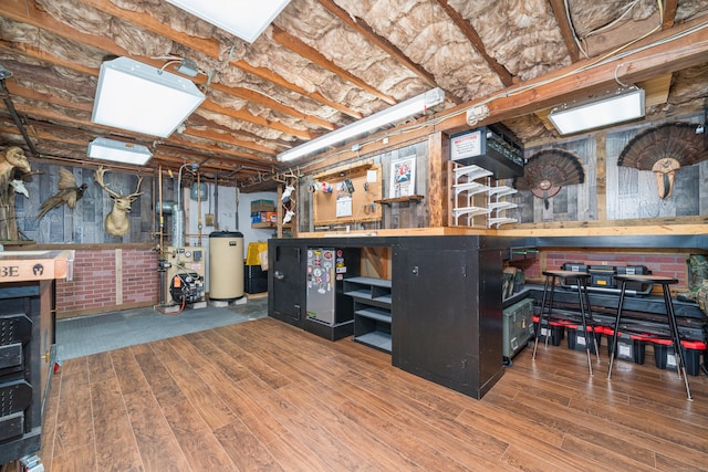 995 Maple St, Wethersfield, CT 06109 - bar area featuring wood finished floors, a heating unit, water heater, and wood walls