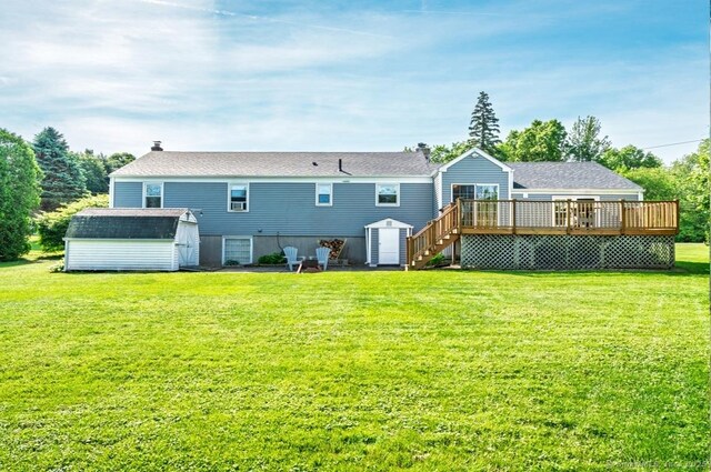 995 Maple St, Wethersfield, CT 06109 - back of property with a deck, stairs, a lawn, and roof with shingles