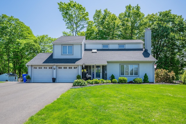 14 Stakey Farm Rd, Southington, CT 06489 - view of front facade with driveway, stucco siding, a chimney, a front yard, and a shingled roof