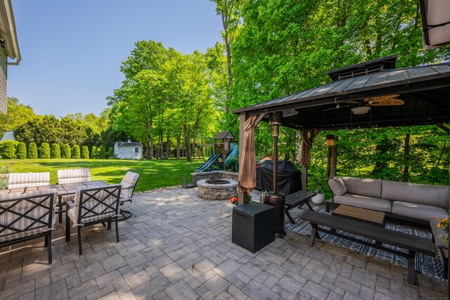 14 Stakey Farm Rd, Southington, CT 06489 - view of patio featuring a gazebo, an outdoor living space with a fire pit, a playground, outdoor dining space, and area for grilling