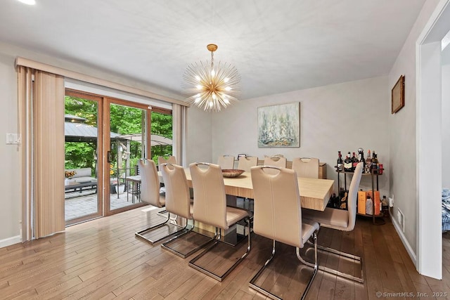 14 Stakey Farm Rd, Southington, CT 06489 - dining room featuring wood-type flooring, a chandelier, and baseboards