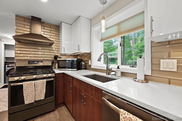 14 Stakey Farm Rd, Southington, CT 06489 - kitchen with stainless steel appliances, wall chimney exhaust hood, a sink, light countertops, and white cabinets