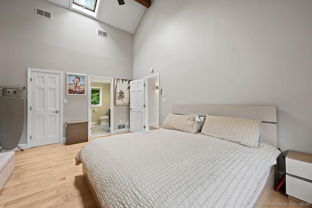 14 Stakey Farm Rd, Southington, CT 06489 - bedroom featuring light wood-style flooring, high vaulted ceiling, baseboards, ensuite bathroom, and a skylight