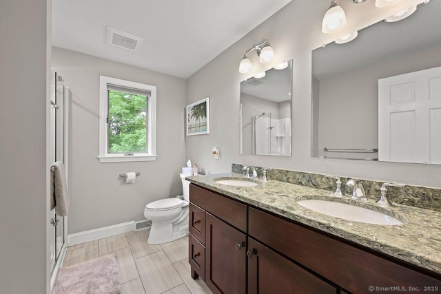 14 Stakey Farm Rd, Southington, CT 06489 - bathroom with a stall shower, baseboards, double vanity, and toilet